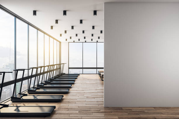 istock White blank wall in modern gym with wooden floor 1192680281