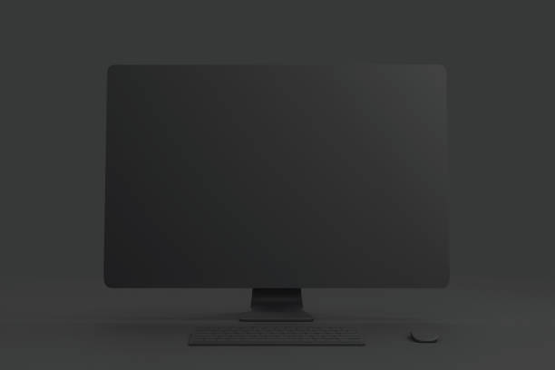 istock All black minimal concept with blank black single material computer at abstract dark background. 1192680316