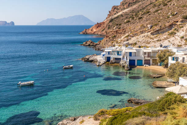 istock Fourkovouni beach with houses, cliffs and vegetation 1192681456