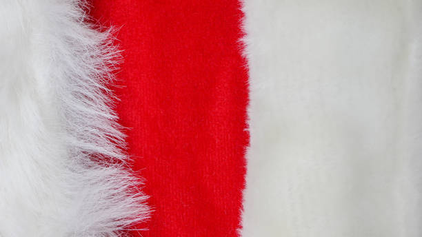 istock red and white fabric christmas background, red cloth and soft white fur 1192682088