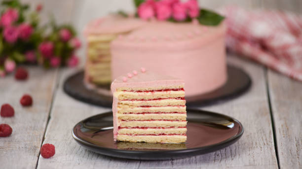 istock Slice Of Layered Creamy Fruit Cake. Raspberry Layer Cake. 1192683122