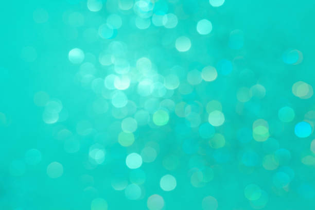 istock Christmas aque menthe abstract background with blurred  sparkles 1192683191