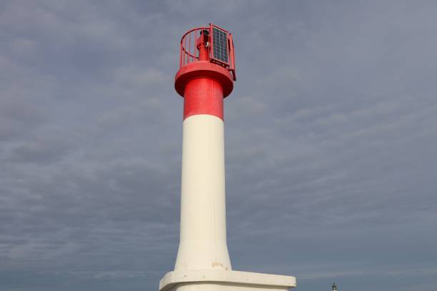 istock Red and white lighthouse on the Mediterranean Sea 1192686793