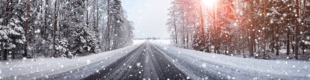 istock winter road, covered with snow on sunny day 1192691852