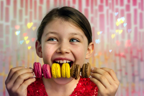 istock beautiful girl with macaroons in her hands 1192693726