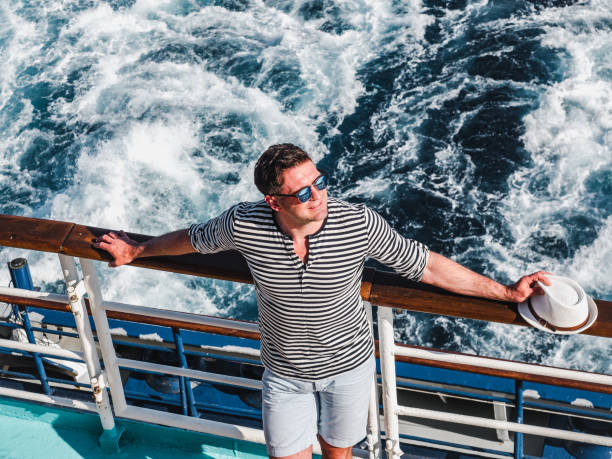istock Smiling man on the empty deck of a liner 1192695205