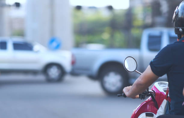 istock Motorcycle waiting for green light on crossroad with safty helmet 1192697389