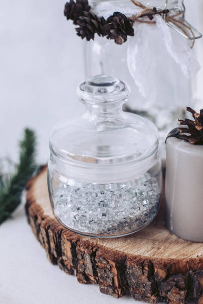 istock Glass jar with broken glass, standing on a log 1192701474