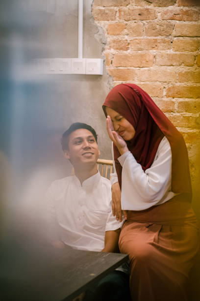 istock Beautiful Couple Happily Together at Cafe 1192701524