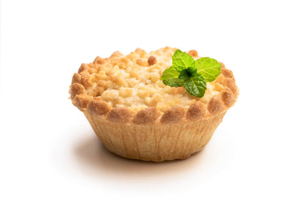 Mini  apple and pear custard crumble tart isolated on white