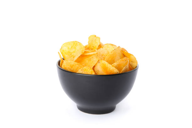 istock Potato chips in a black bowl isolated on white background, space for text 1192704631