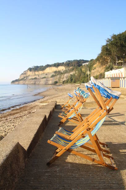 Deckchairs on the promenade overlooking Shanklin beach on the Isle of Wight.