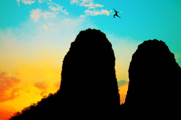 Paraglider soaring in the sky over the mountains. LionÂ´s Head and Table Mountain. Cape Town.  Camps Bay. Panorama.