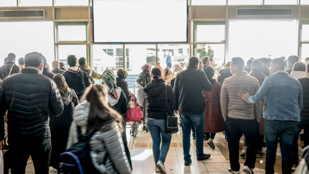 istock People Coming Out The Door 1192710901