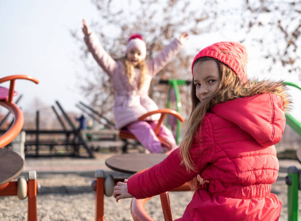 istock Girls enjoying outdoors at playground 1192712171