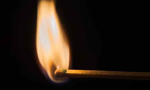 istock The match burns with an even flame on a dark 1192717532