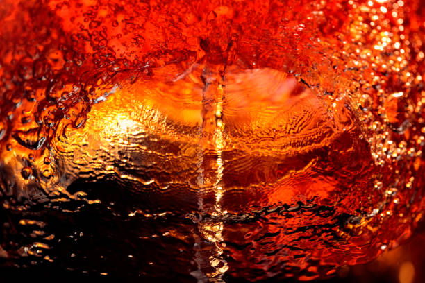 istock Alcoholic drink on a dark background, abstract splashing. 1192718627