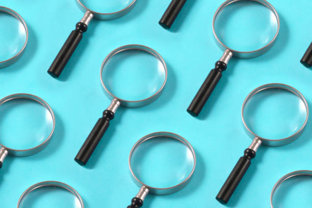 istock Magnifying Glasses on Blue Background 1192719181