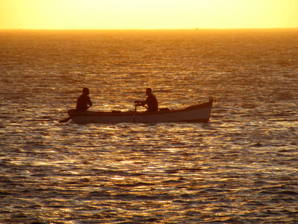 istock The fishing begins before sunset and extends into the night. 1192719280