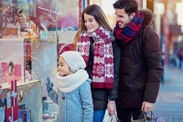 istock Young couple is looking store window at Christmas 1192721750