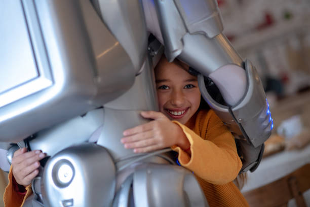 istock Cute girl feeling protected with her robot 1192723107