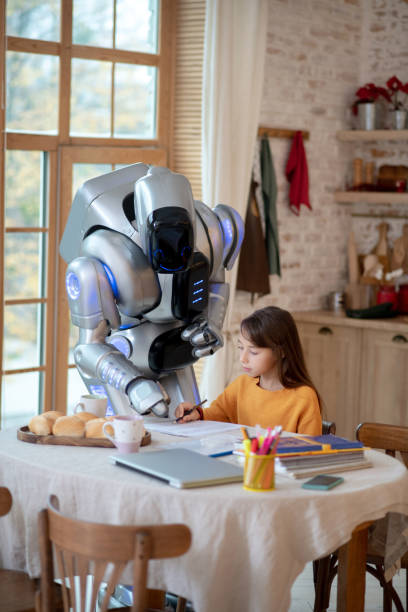 istock Robot teacher pointing to mistake in writing 1192723165