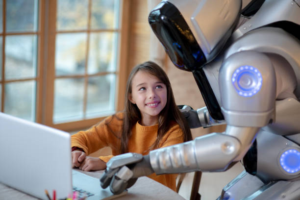 istock Robot helping a girl with her homework 1192723178