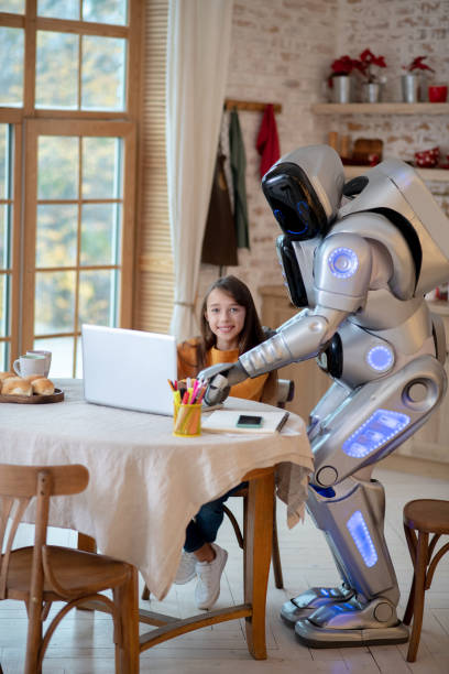 istock Dark-haired girl doing her homework in the kitchen 1192723193