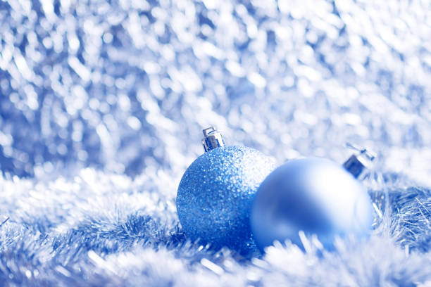 Silver Christmas balls on shiny background stock photo
