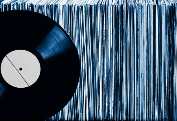 Vinyl record on a collection of albums stock photo