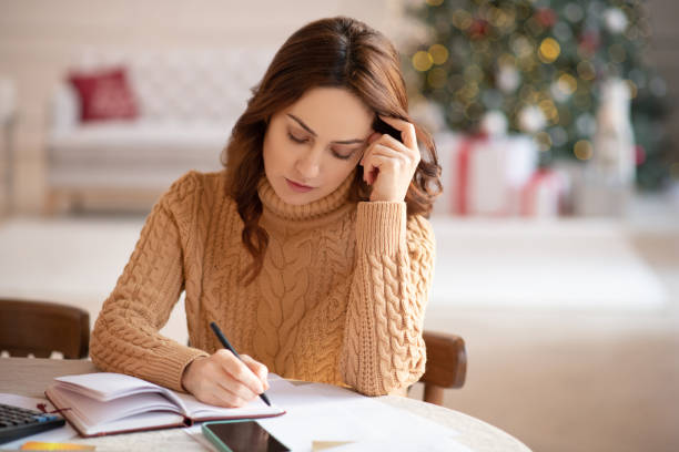istock Dark-haired woman in knitted sweater looking bored 1192726864