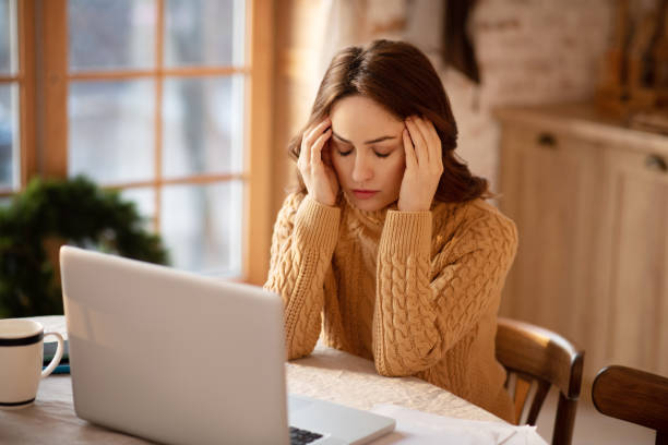 istock Woman with long hair suffering from headache 1192727123
