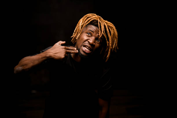istock Afro american guy points with fingers at his jaw 1192728676