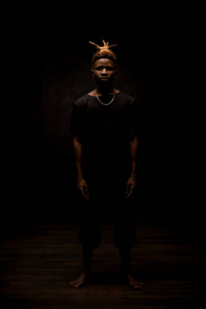 istock Afro american guy posing in all black outfit 1192728702