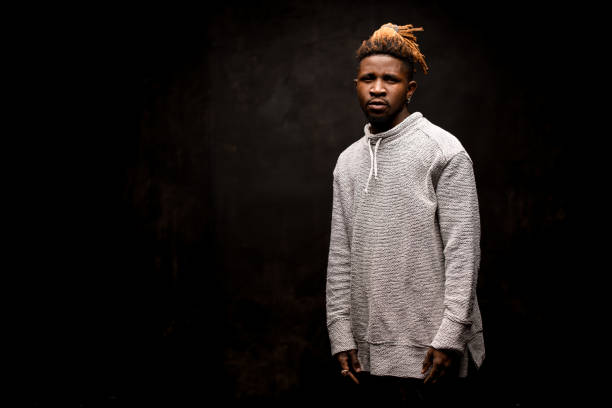 istock Afro american guy posing on a dark background 1192728718