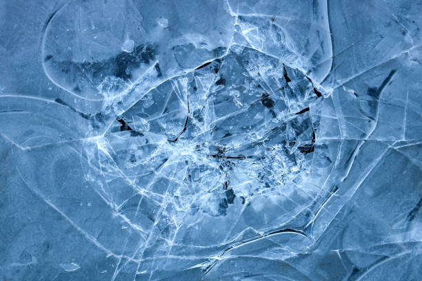 istock Shattered Frozen Puddle on a Forest Footpath 1192728756