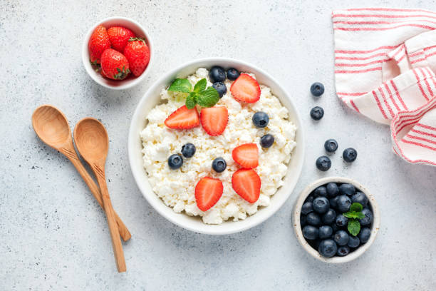 istock Cottage cheese, curd cheese or tvorog with fresh berries 1192729389