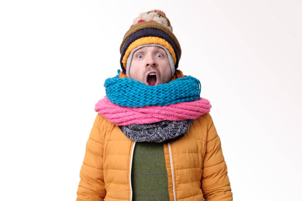 istock Handsome caucasian funny man in several hats and scarfs. 1192730797