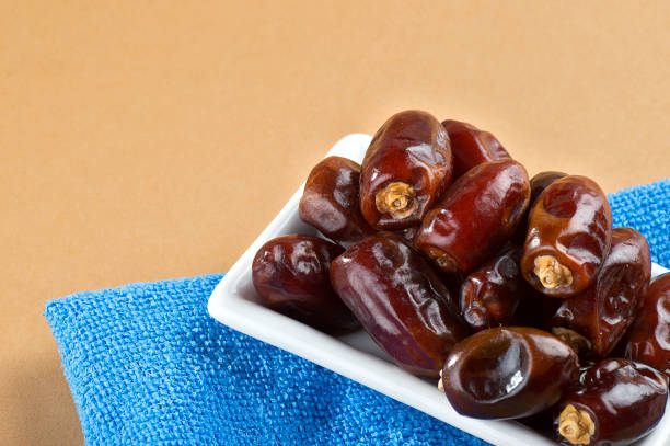 istock Dates in plate. Dried dates fruits. 1192732071