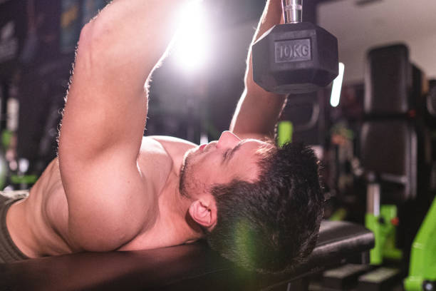 istock Close-up shot of shirtless man doing exercises 1192734794