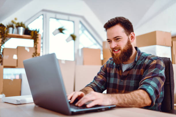 istock Handsome Male Checking Daily Activity Log On Laptop In Delivery Office 1192736462