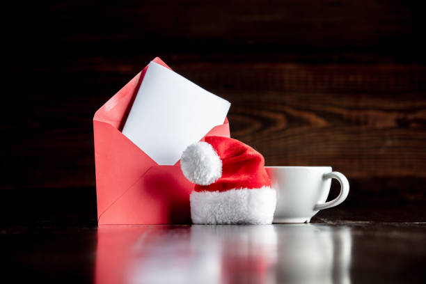 istock Santa Claus hat and cup with envelope 1192737409