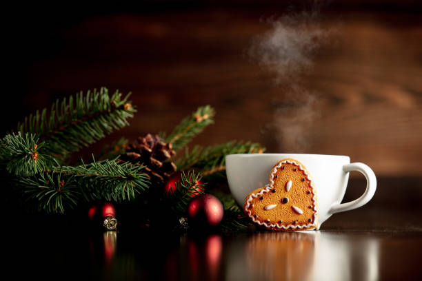 istock Cup of coffee and gingerbread cookie on a table 1192737440