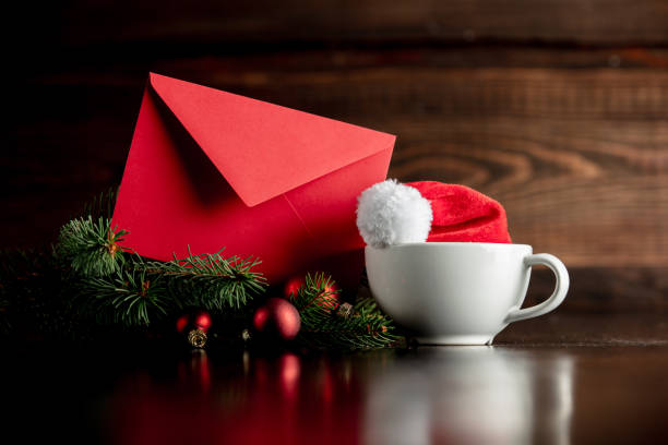 istock Santa Claus hat and cup with envelope 1192737446