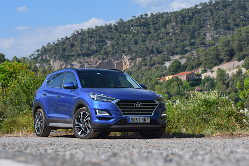 Barcelona, Spain - 5th July, 2018: Blue modern SUV - Hyundai Tucson after facelift - stopped on a road. This car is the most popular SUV from Hyundai brand.