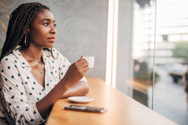 istock Woman drinking coffee at the cafe 1192741722