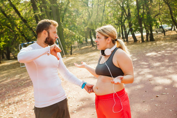 istock Overweight woman exercising. 1192742479