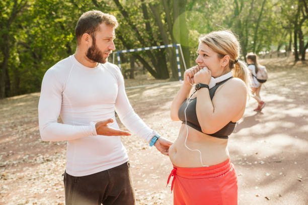 istock Overweight woman exercising. 1192742582