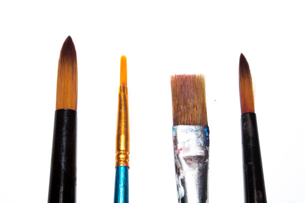 istock Messy Used Paint Brushes on White background 1192743577