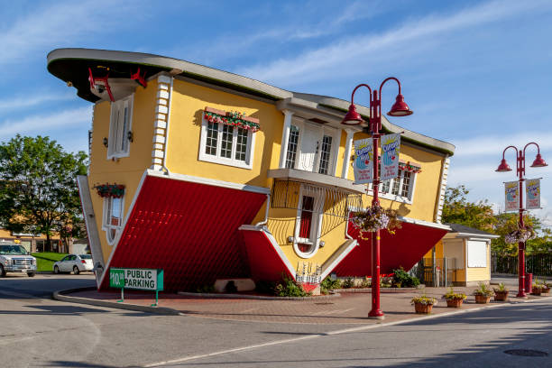 Upside Down House on the Clifton Hill in Niagara Falls, Ontario, Canada. Niagara Falls, Ontario, Canada - September 3, 2019: Upside Down House on the Clifton Hill in Niagara Falls, Ontario, Canada. upside down stock pictures, royalty-free photos & images